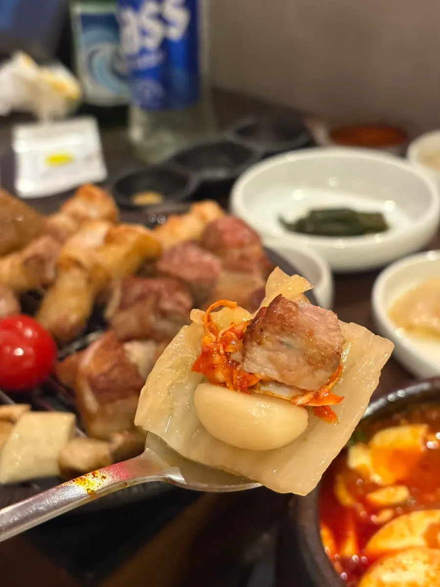 Grilled meat enjoyed with accompaniments