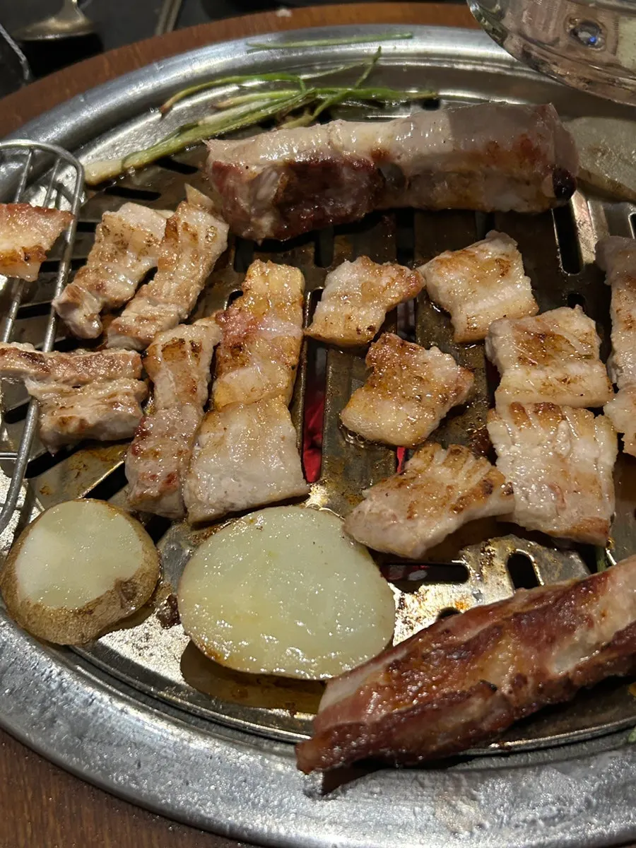 Pork ribs served with salted seafood and ssam wraps