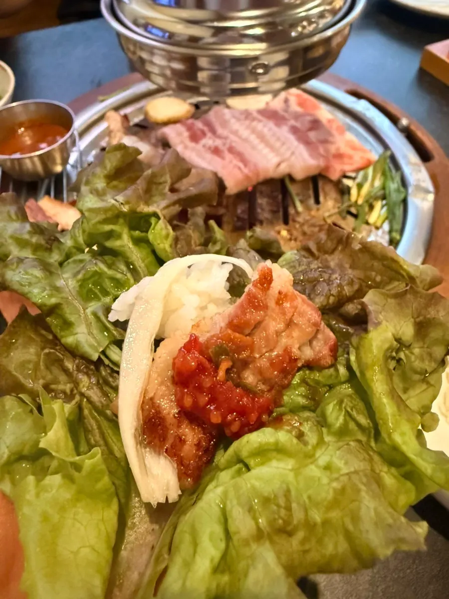 A piece of pork rib placed on white rice