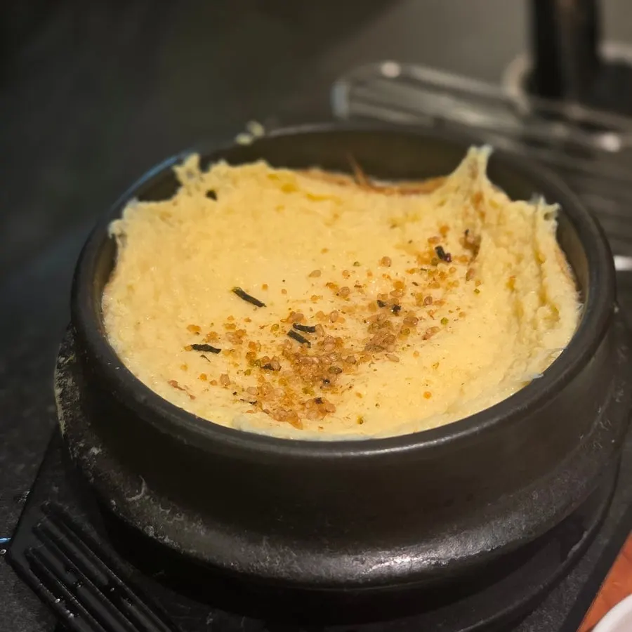 Fluffy steamed egg served in an earthenware pot