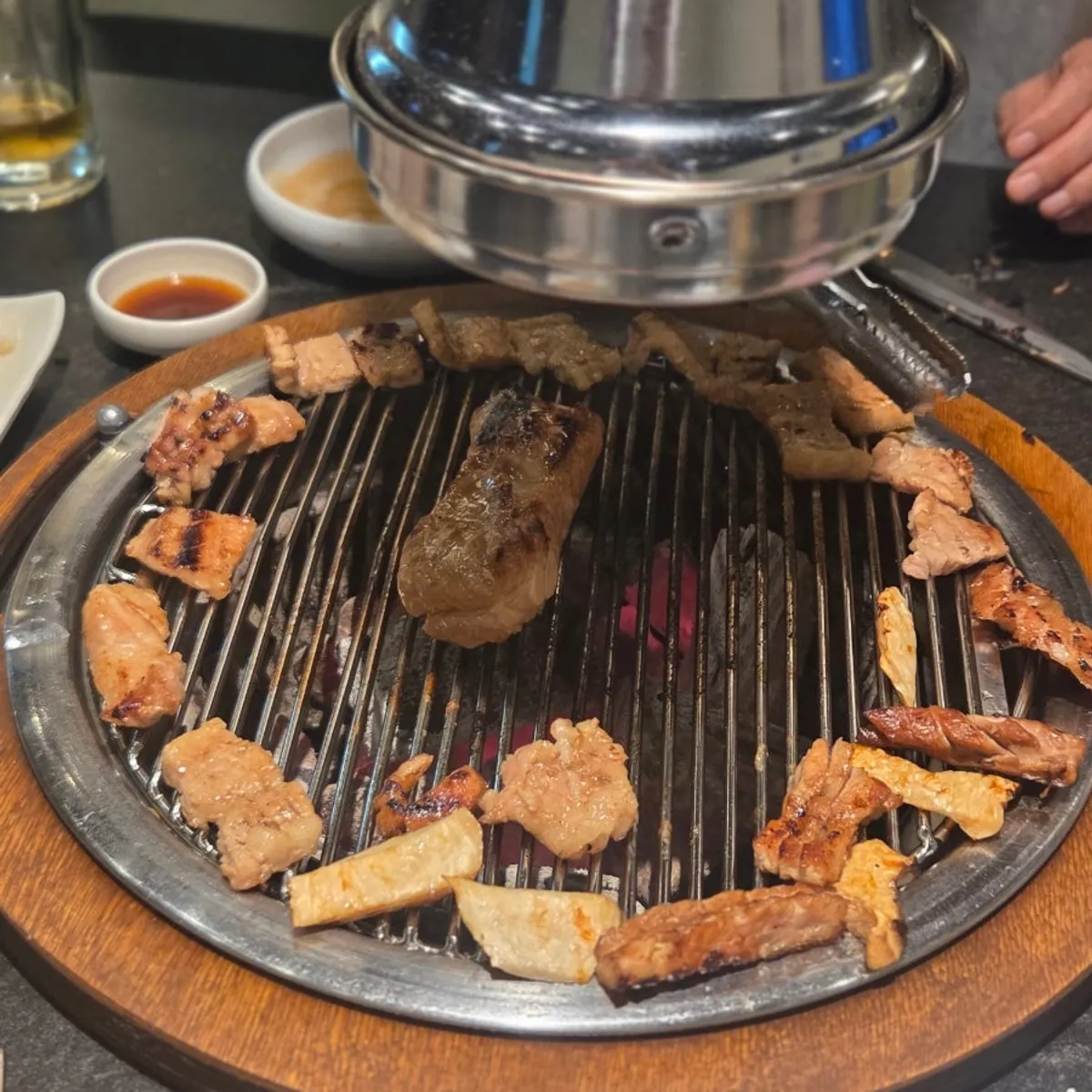 Marinated pork ribs grilled with adjusted flame size