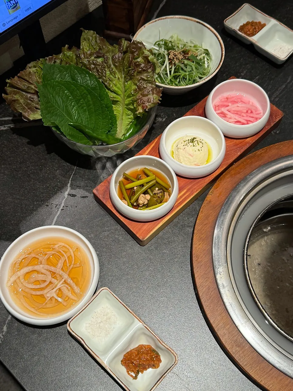 Side dishes including truffle potato salad and barley baek-kimchi