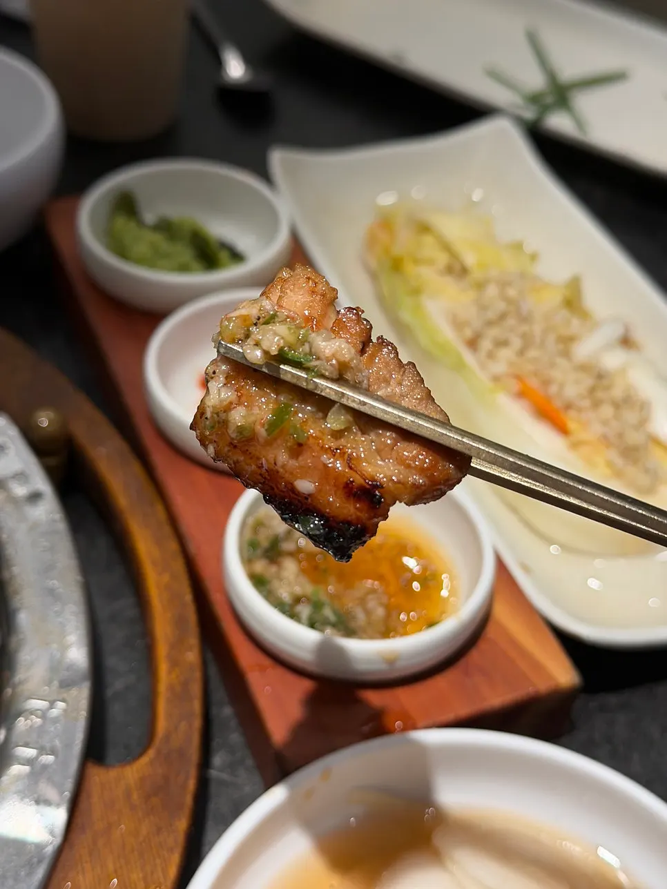 A fully-grilled piece of marinated pork rib