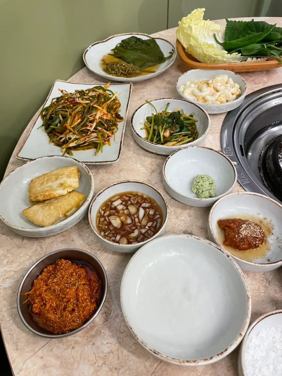 1-hour Saturday wait for skewered gamjagisal BBQ in Seomyeon, Busan