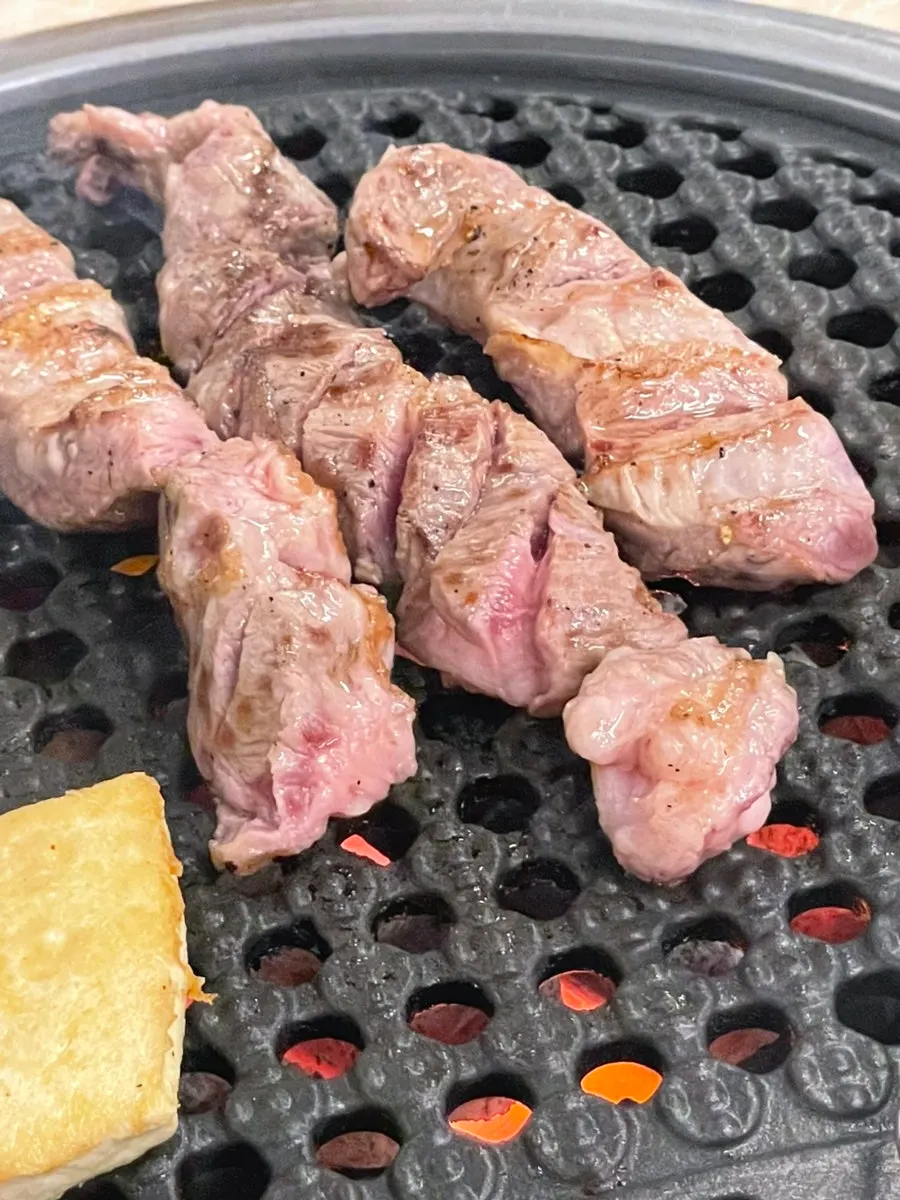 Gamjagisal cooking on the grill