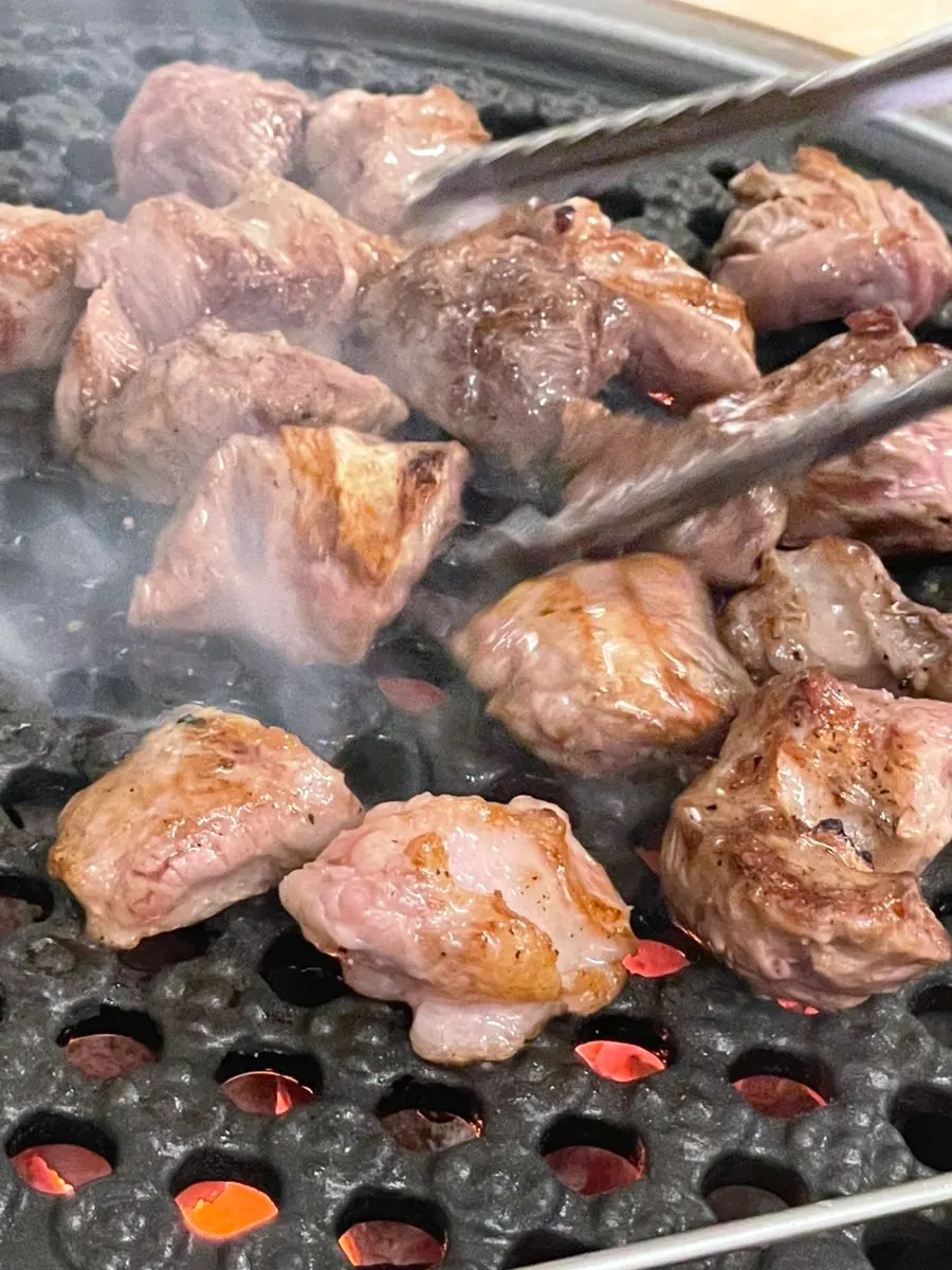 Grill piled high with meat