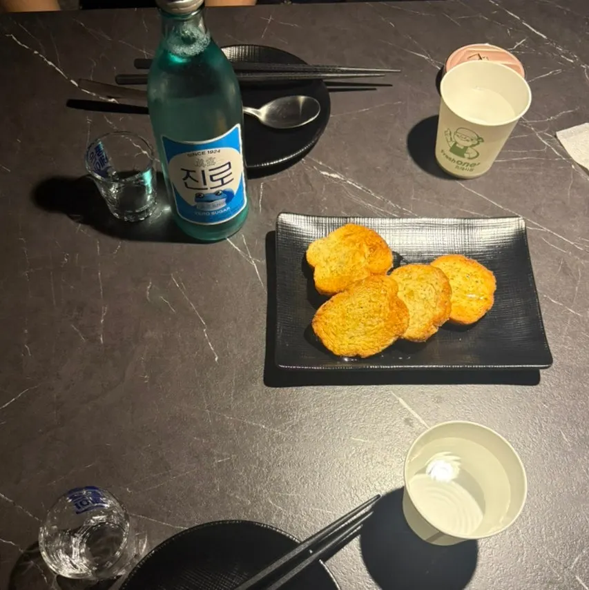 Ordered bottle of Jinro soju and glasses