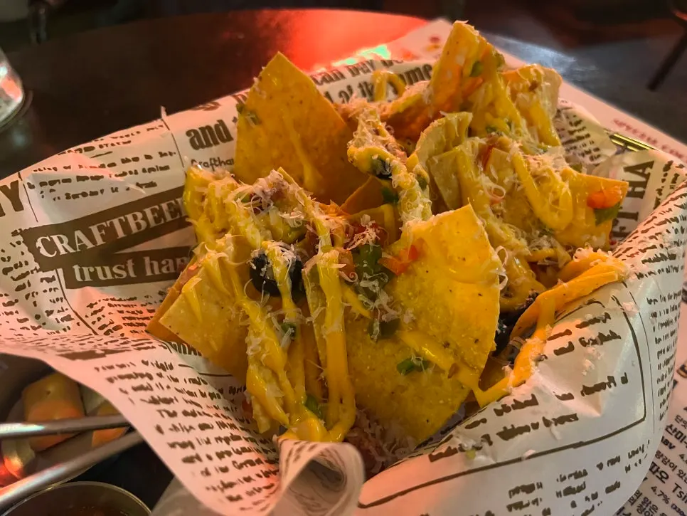 Cheese nachos and beer on the table