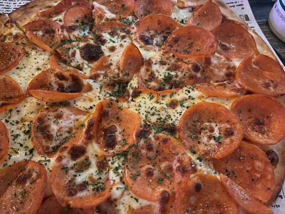 A warm slice of pepperoni pizza