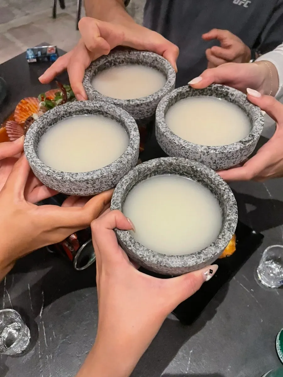 A bottle of Saengtak makgeolli on the table