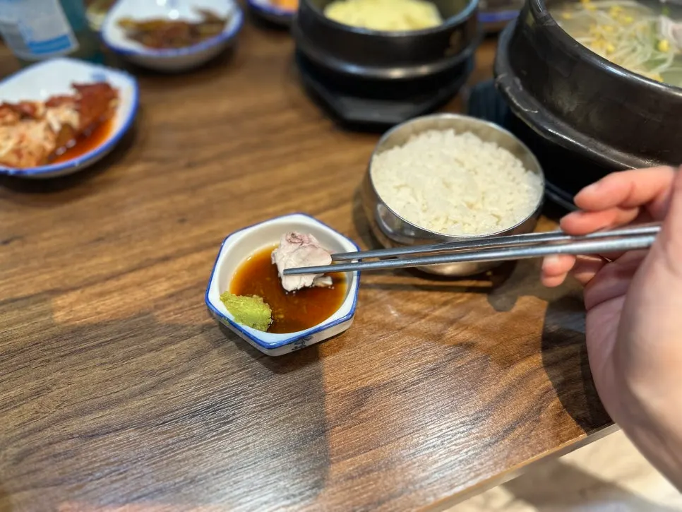 Fresh cham-bok clear soup broth in a ttukbaegi