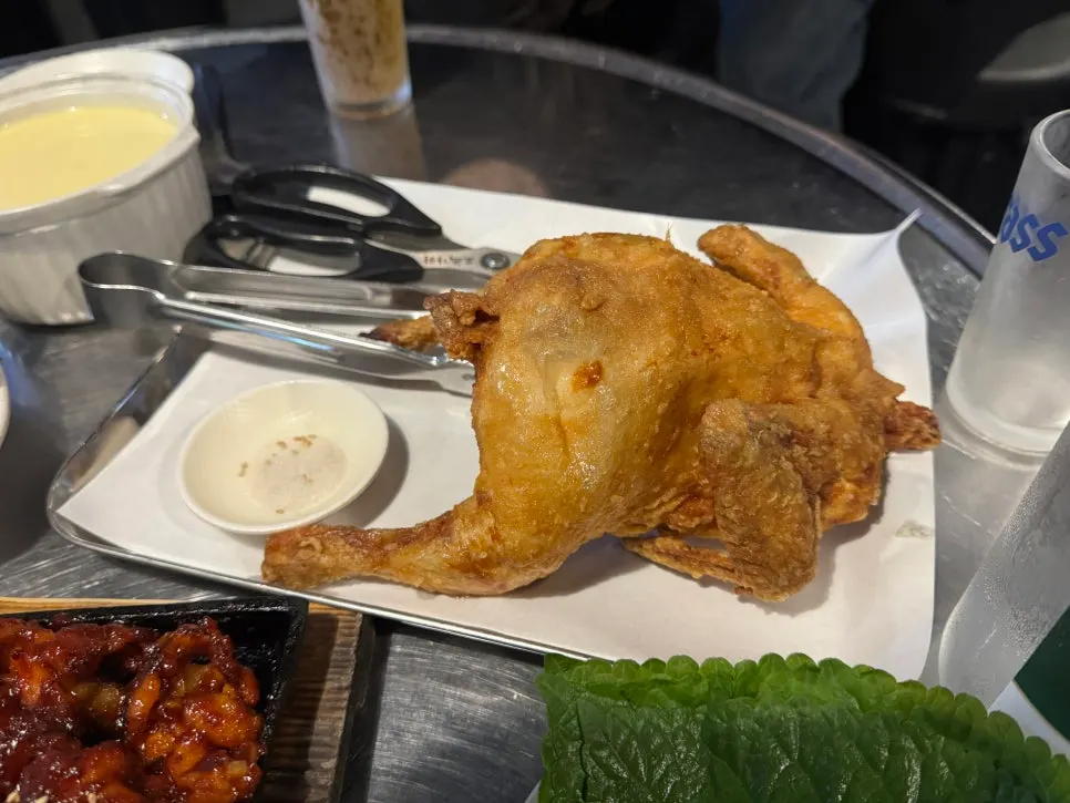 A piece of mild boneless dakbal sprinkled with sesame seeds