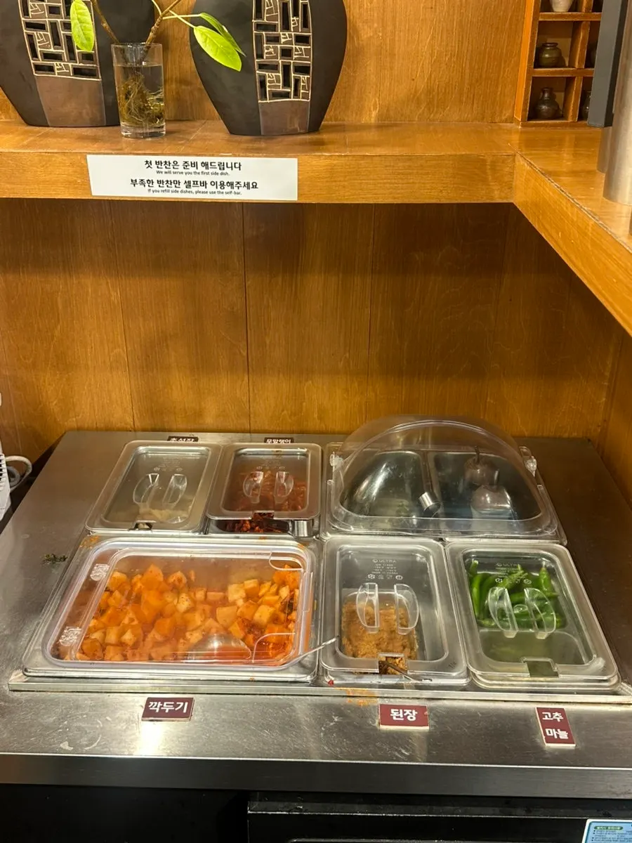 Self-serve bar with side dishes and water