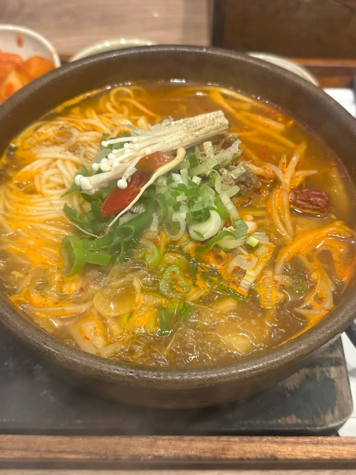 Spicy galbitang served bubbling in a stone pot