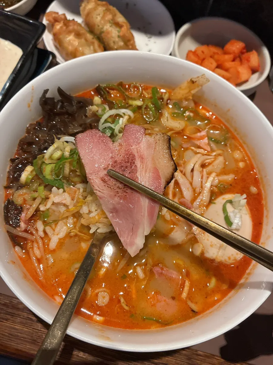 A piece of charcoal-grilled suyuk eaten with gukbap
