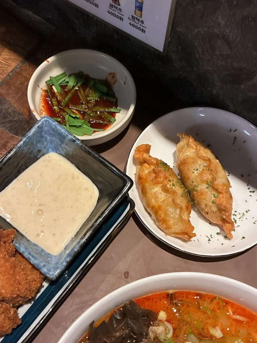 Table spread of charcoal-grilled suyuk with gukbap