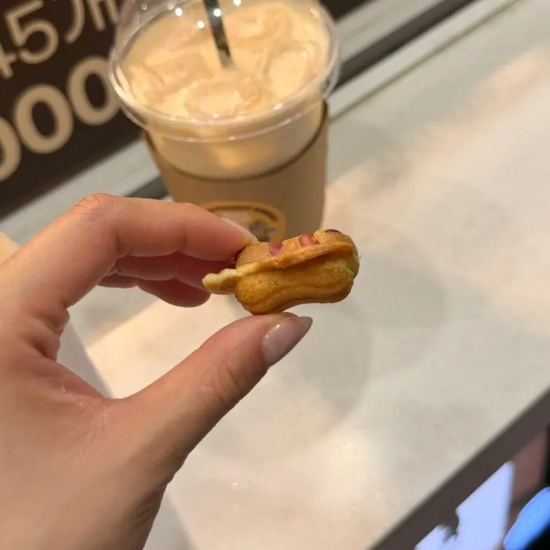 Picking up a bite-sized piece of peanut bread