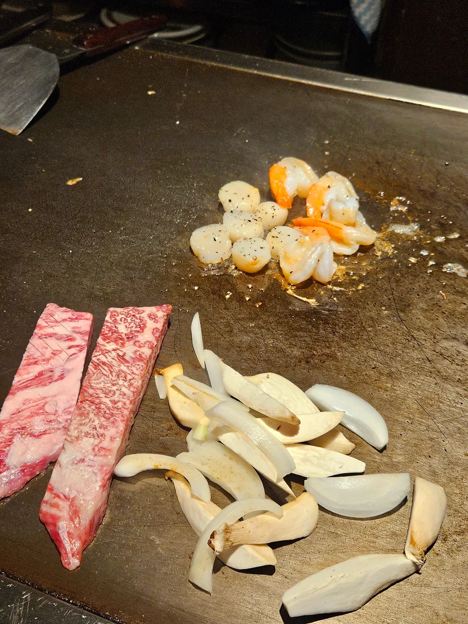 Flames shooting up during Teppan King's teppan performance