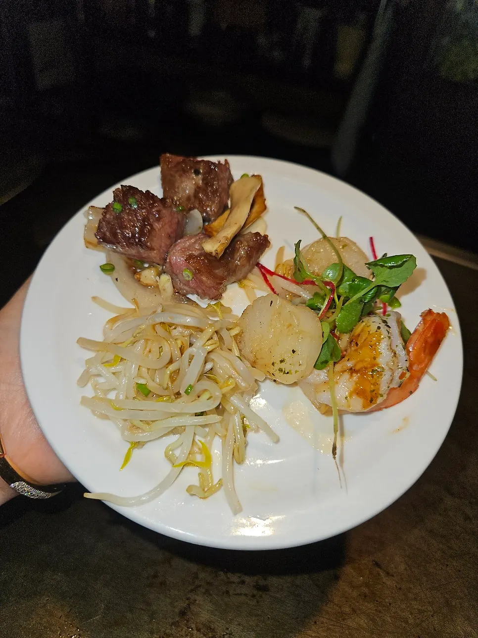 Onions and bean sprouts served with the steak