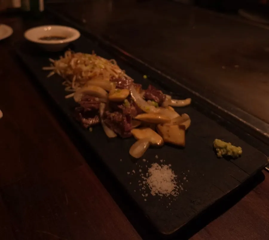 Wagyu rib steak cooking on the teppan
