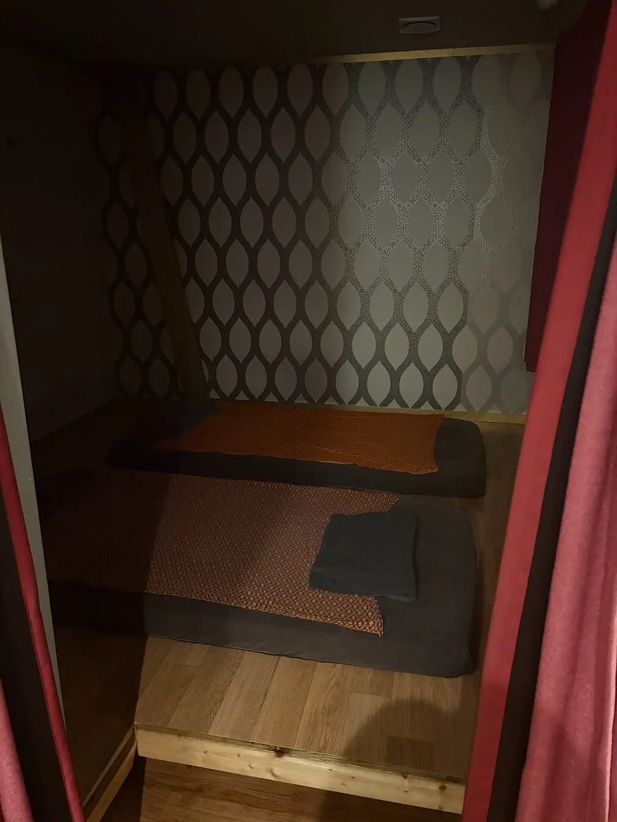 Dimly lit interior of the massage shop