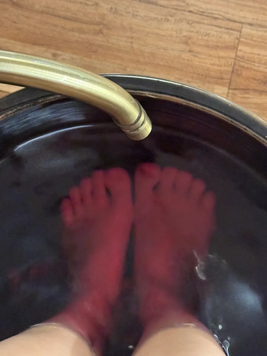Feet soaking in a warm foot bath