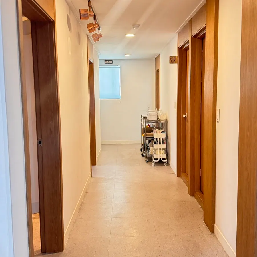 Interior of the white and wood-toned treatment room