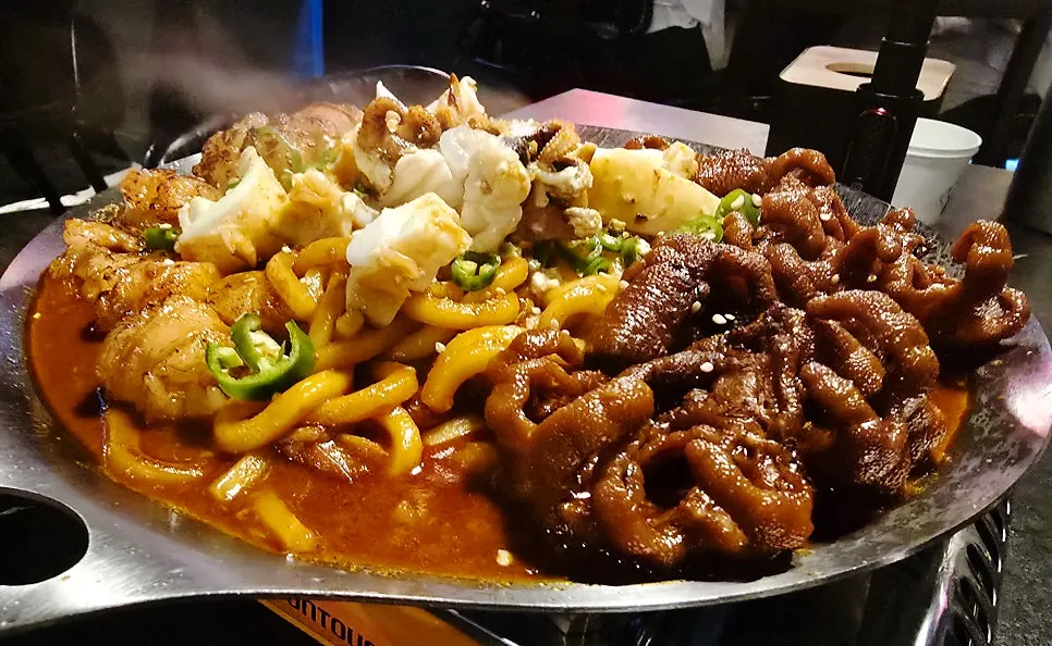 O-Dae-Bal platter with grilled intestine, chicken feet, and cuttlefish on one plate