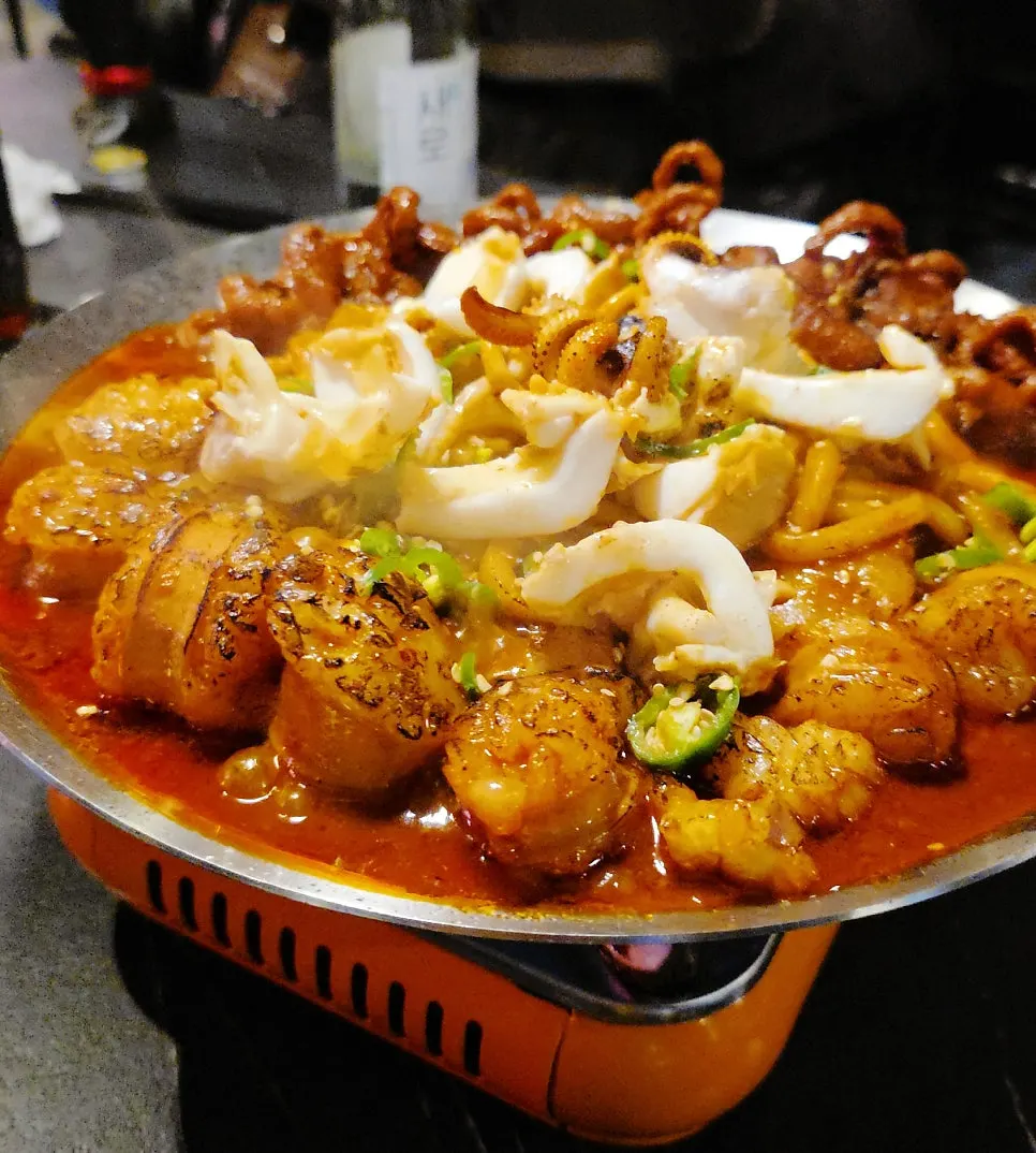 Close-up of sauce-coated grilled intestine