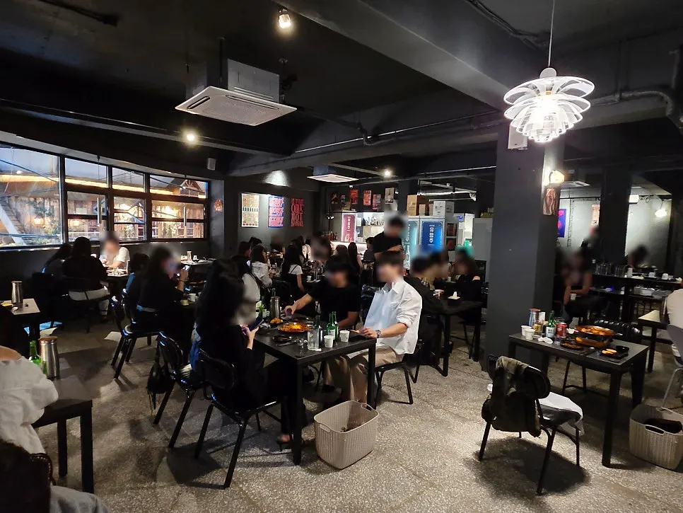 Interior view of the Seomyeon bar filled with customers