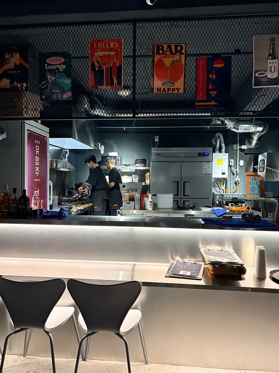 Bar seats facing the open kitchen