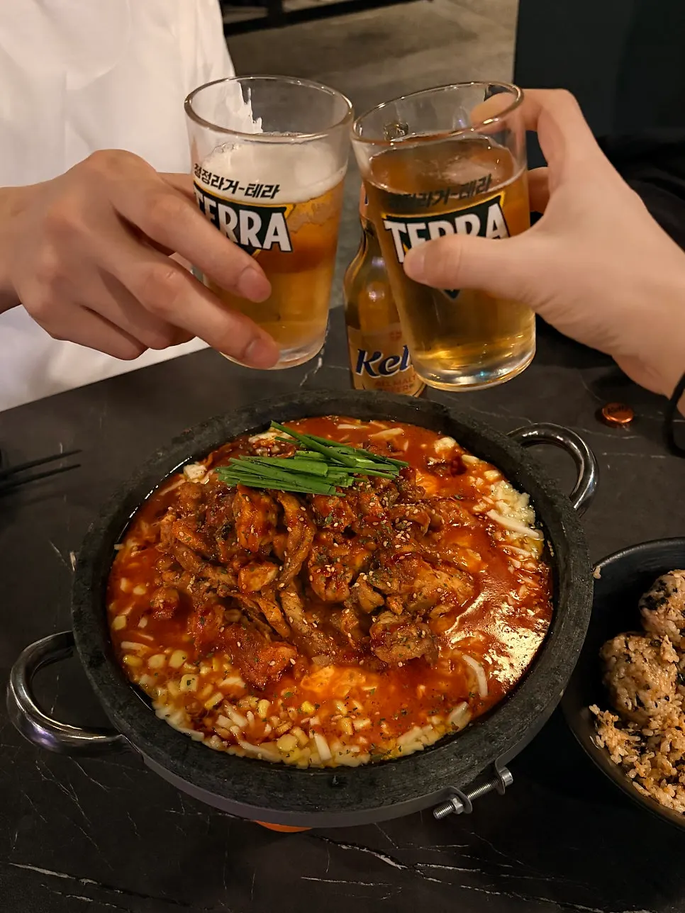 Clinking glasses together over the dish