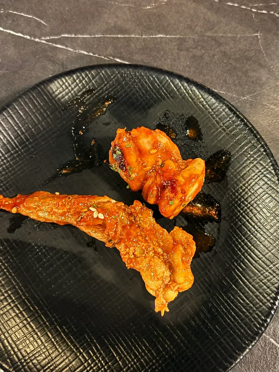 Picking up a large piece of boneless chicken neck meat