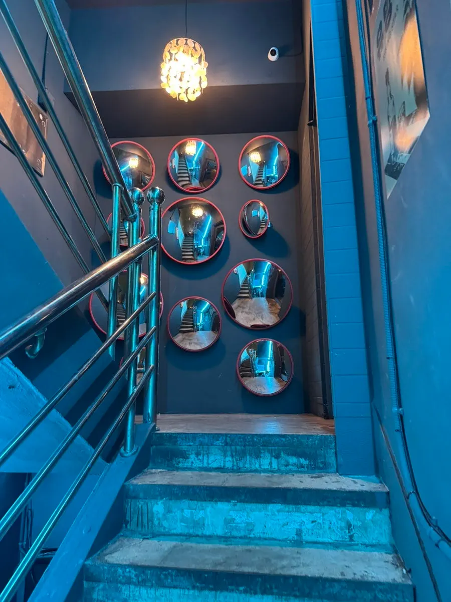 Convex-mirror photo spot in front of the bar