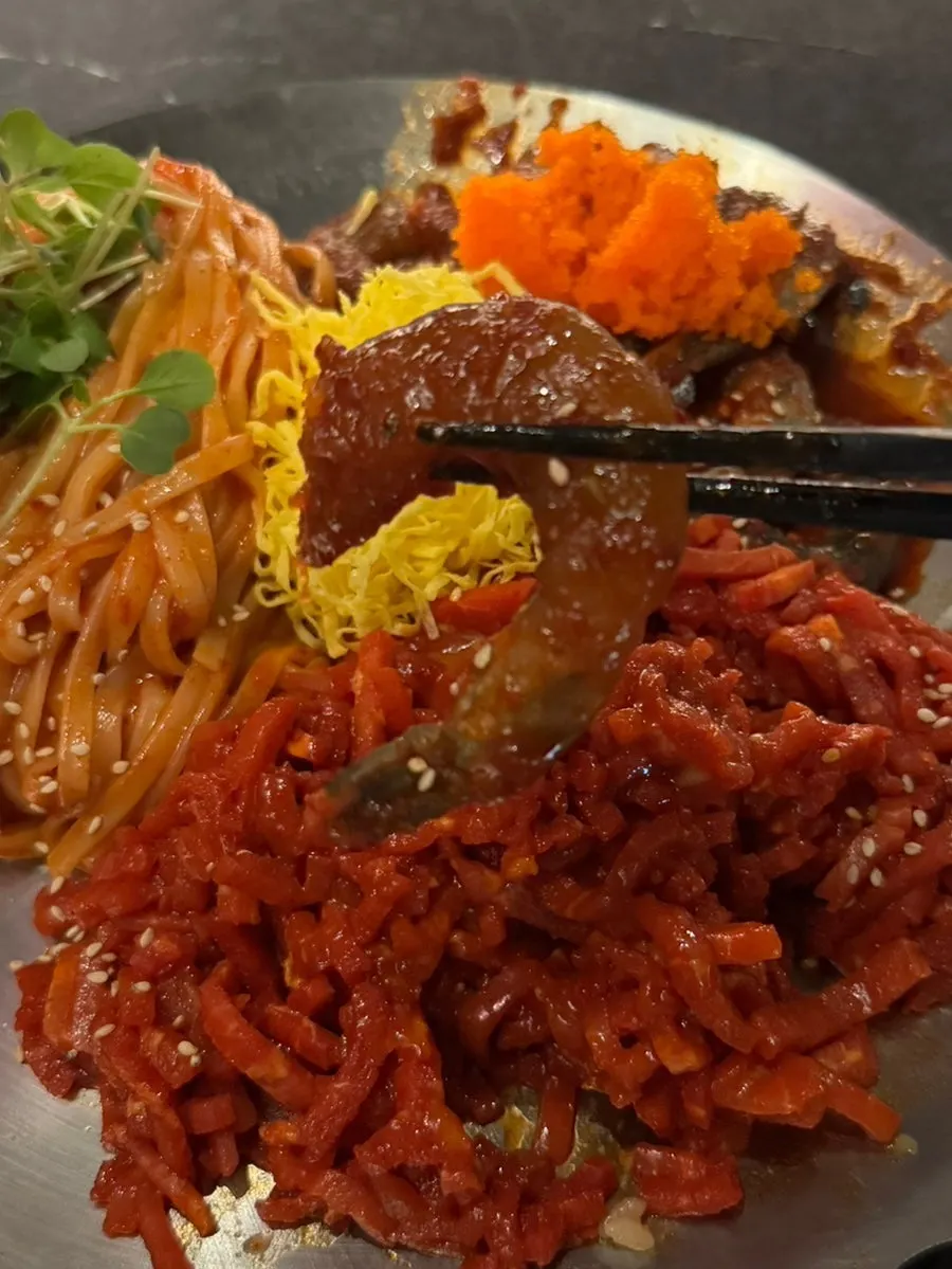 Yukhoe topped with egg strips