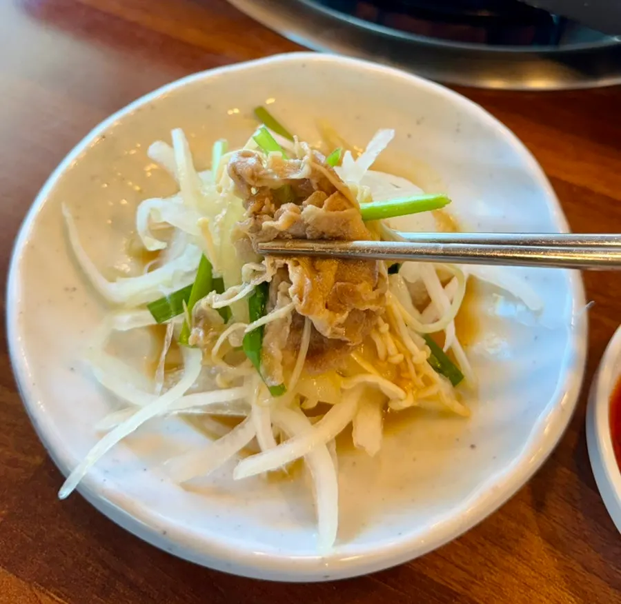 A thinly sliced, tender piece of cooked duck meat