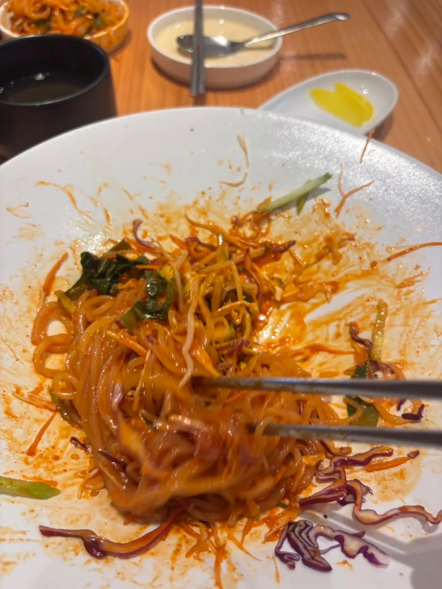 Mixed jjolmyeon with egg topping