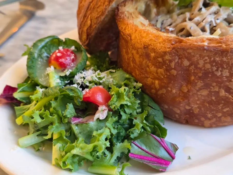 Salad served alongside the pasta