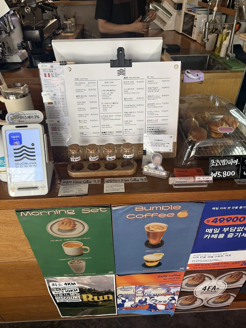 Dessert case displaying cakes and breads