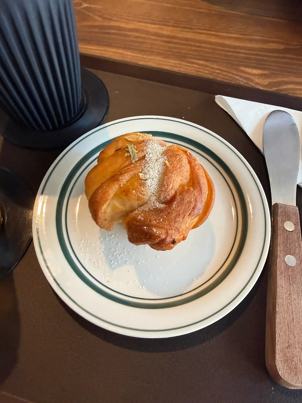 Cardamom bun sprinkled with cinnamon powder