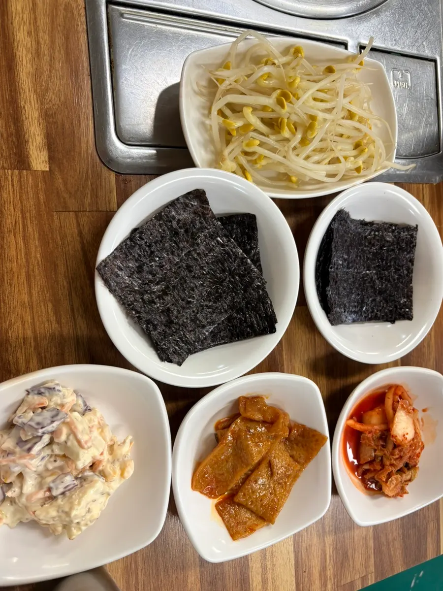 Side dish spread with bean sprouts, seaweed, and braised fish cake