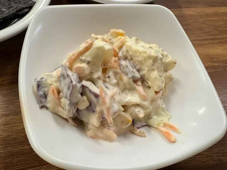 Salad served alongside the meal