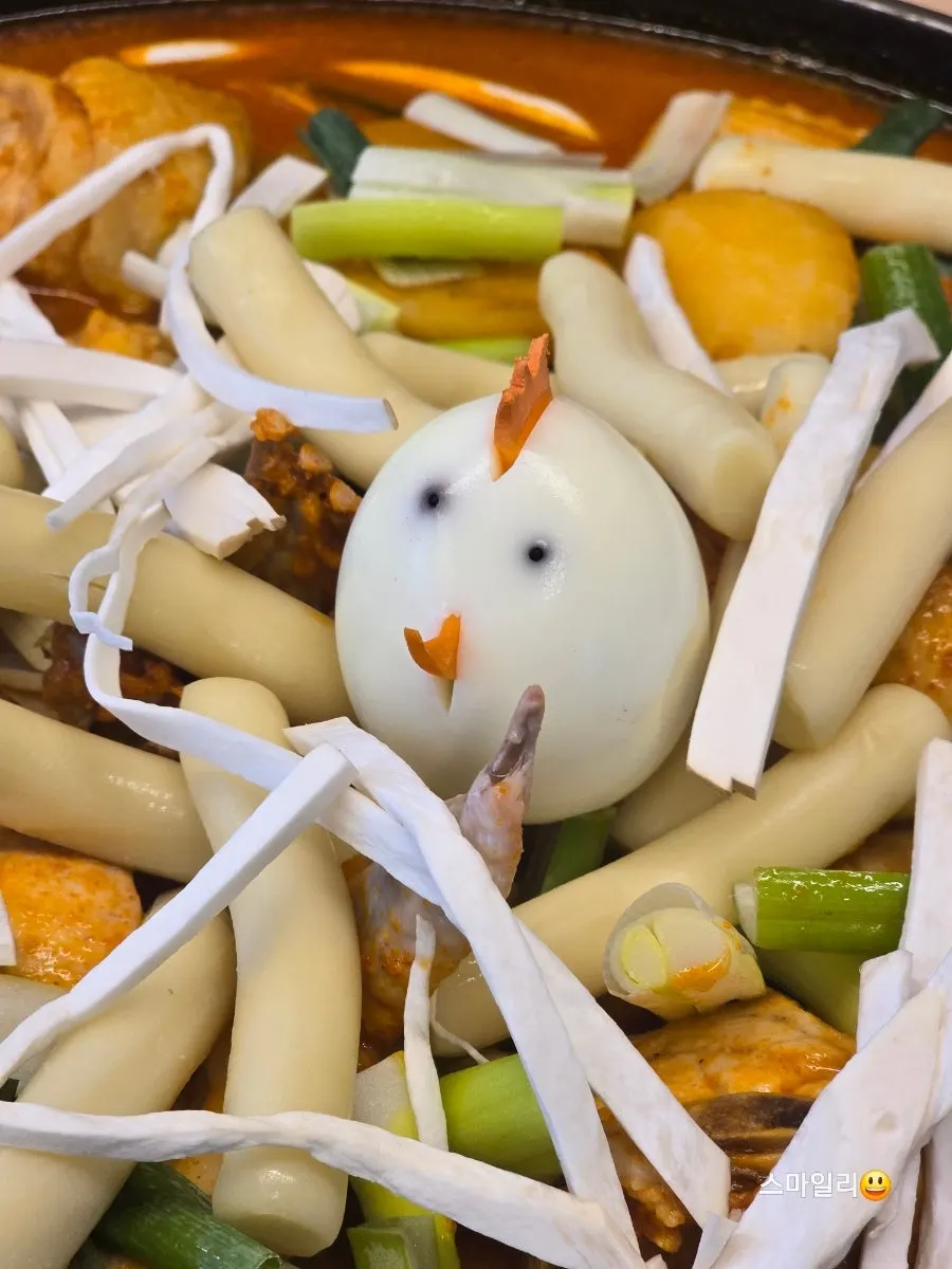 Boiled egg decorated to look like a chicken