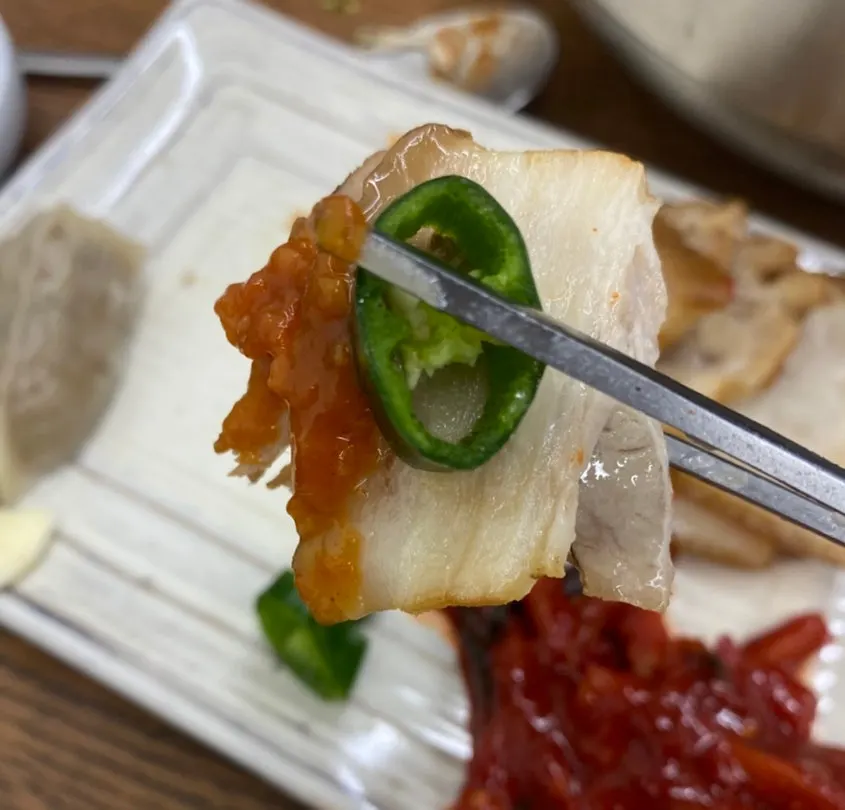 A piece of suyuk topped with dried radish strips
