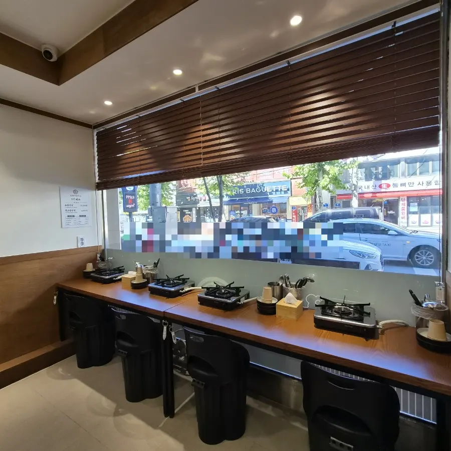 Bar-style solo dining seats by the window