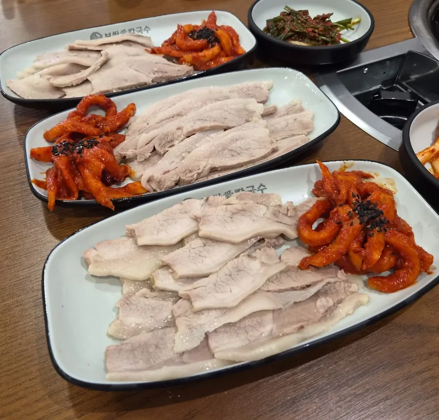Free seafood kalguksu simmering at the table