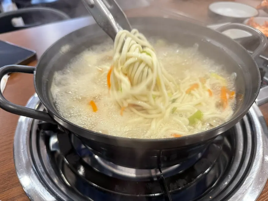 ポッサムにキムチをのせた一包み