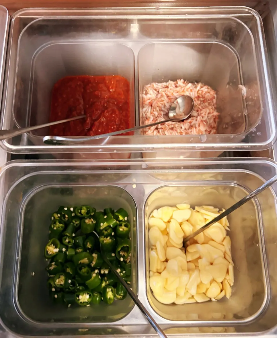 Clean self-bar with green onion kimchi and cabbage kimchi