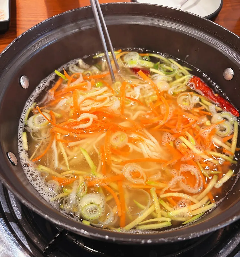 A finished bowl of boiled seafood kalguksu