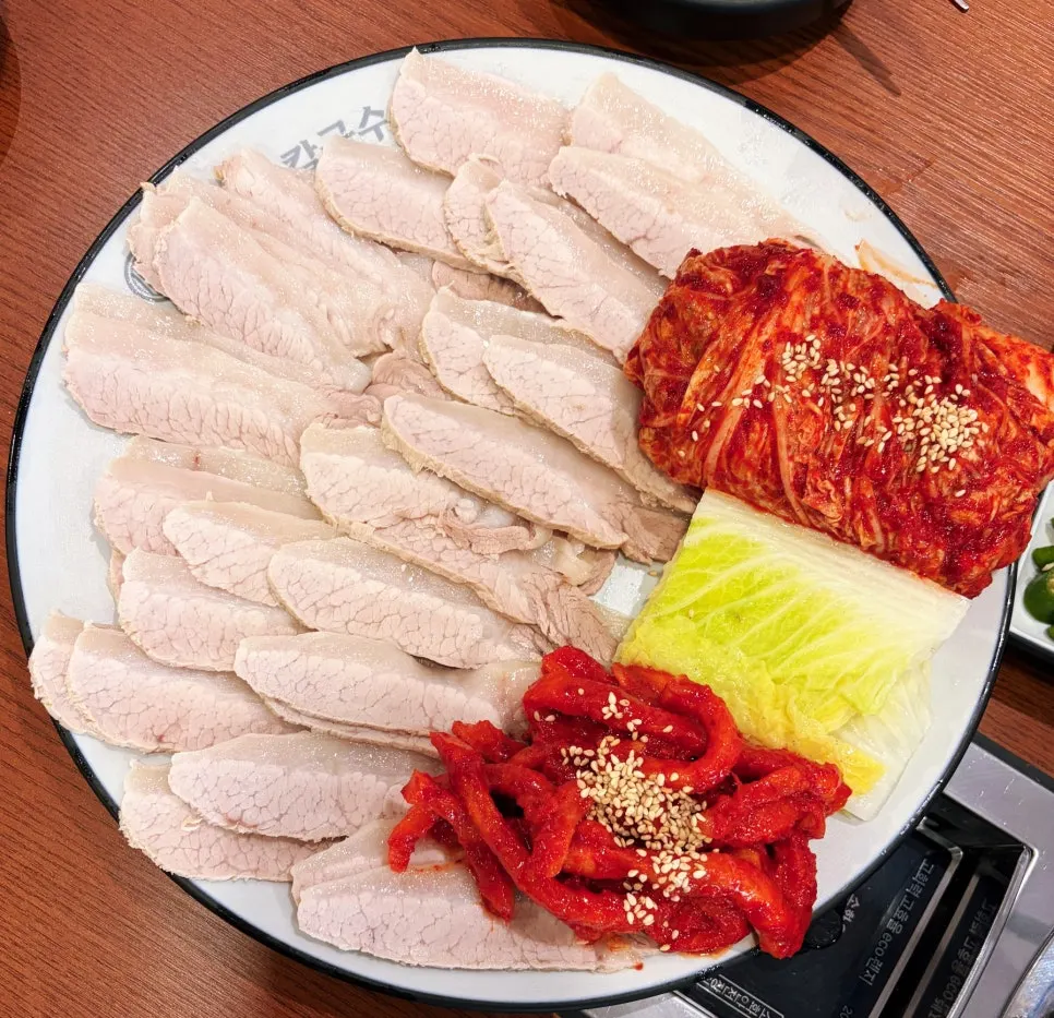 Kimchi made with Haenam cabbage plated alongside bossam